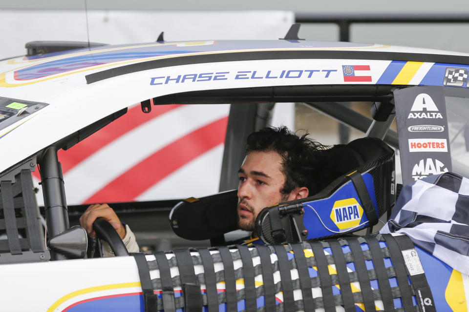 Chase Elliott drives into victory lane after winning a NASCAR Cup Series auto race at Charlotte Motor Speedway in Concord, N.C., Sunday, Oct. 11, 2020. (AP Photo/Nell Redmond)