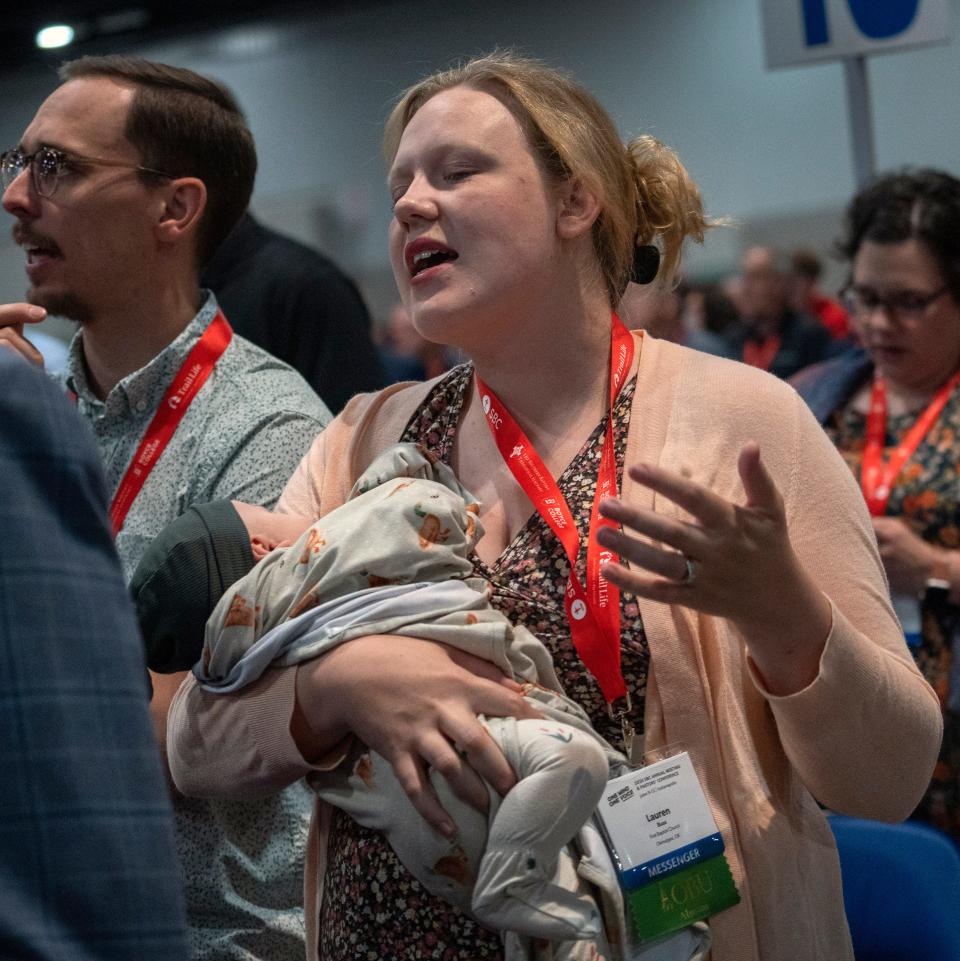 Lauren Buss, from the First Baptist Church in Okmulgee, OK, joins others in song during the Southern Baptist Convention, Tuesday, June 11, 2024 at the Indiana Convention Center.