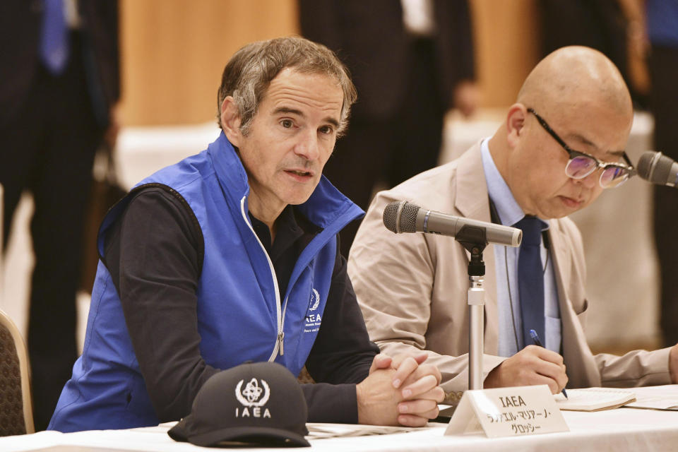 International Atomic Energy Agency chief Rafael Mariano Grossi, left, attends a meeting in Iwaki, Fukushima prefecture, Japan Wednesday, July 5, 2023. The U.N. nuclear chief is to visit Japan's tsunami-wrecked nuclear power plant Wednesday after the agency affirmed the safety of a contentious plan to release treated radioactive water into the sea. (Kyodo News via AP)