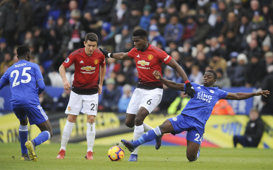 Leicester's Nampalys Mendy, right, and Manchester United's Paul Pogba challenge for the ball during the English Premier League soccer match between Leicester City and Manchester United at the King Power Stadium in Leicester, England, Sunday, Feb 3, 2019. (AP Photo/Rui Vieira)