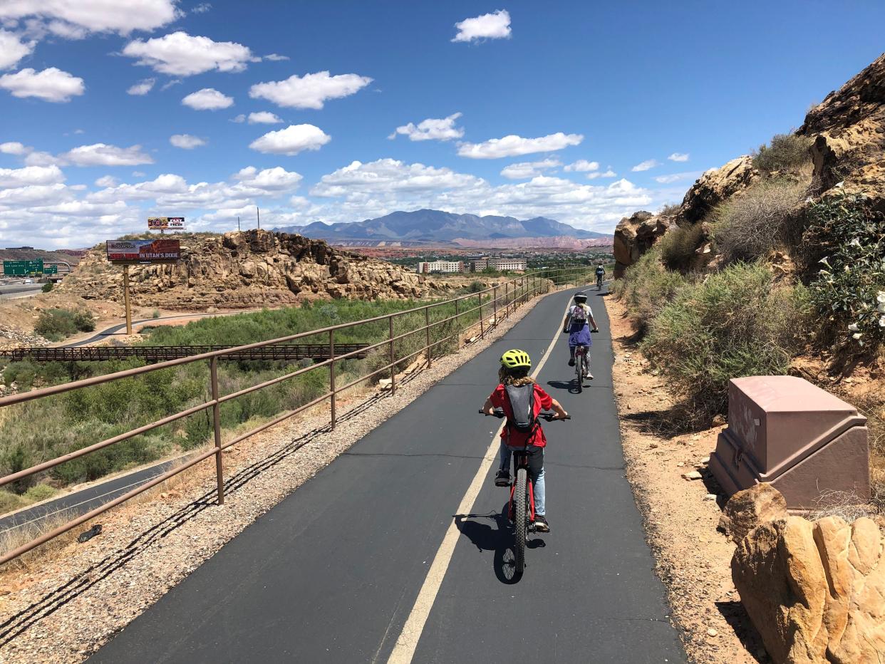 Cyclists head north into central St. George along one of the city's many paved trails. Outdoor activity like cycling is a major part of the city's plans for both recreation and transportation as population growth and increased visitation put more pressure on local roads, but high temperatures often dissuade people from venturing out during the hottest months.