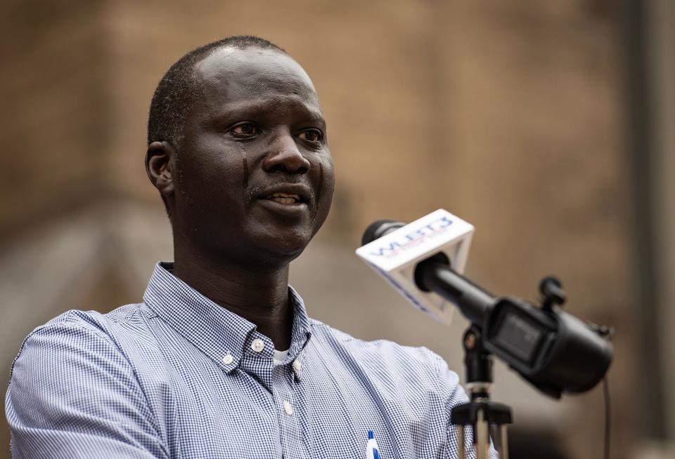 Bul Mabil has tears streaming down his face as he speaks during a press conference to ask for the public's help in finding his brother, Dau Mabil, at St. Andrew's Episcopal Cathedral in Jackson, on Monday, April 1, 2024. Bul Mabil traveled from Houston, Texas after he heard his brother went missing.