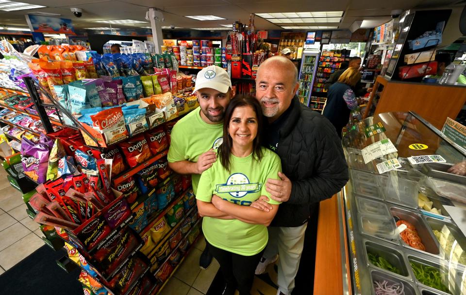 Yatco owners Tarek and Khadijeh Yatim and their son Hussein at 446 Lincoln St. location. Yatco, a family-owned local convenience store/gas station chain, is celebrating its 30th anniversary this year.