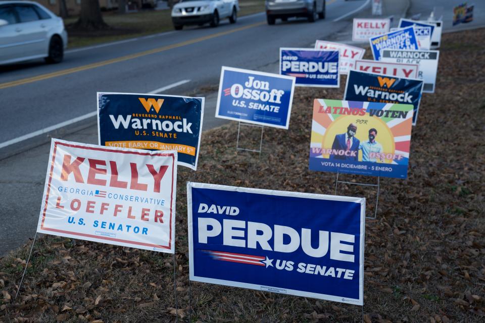 Campaign signs on Jan. 5, 2021, in Atlanta.