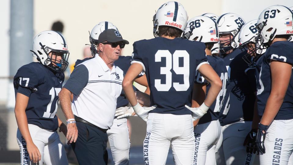 Shawnee's head football coach Tim Gushue speaks to his players prior to the football game between Shawnee and Eastside played at Shawnee High School on Thursday, September 1, 2022.  