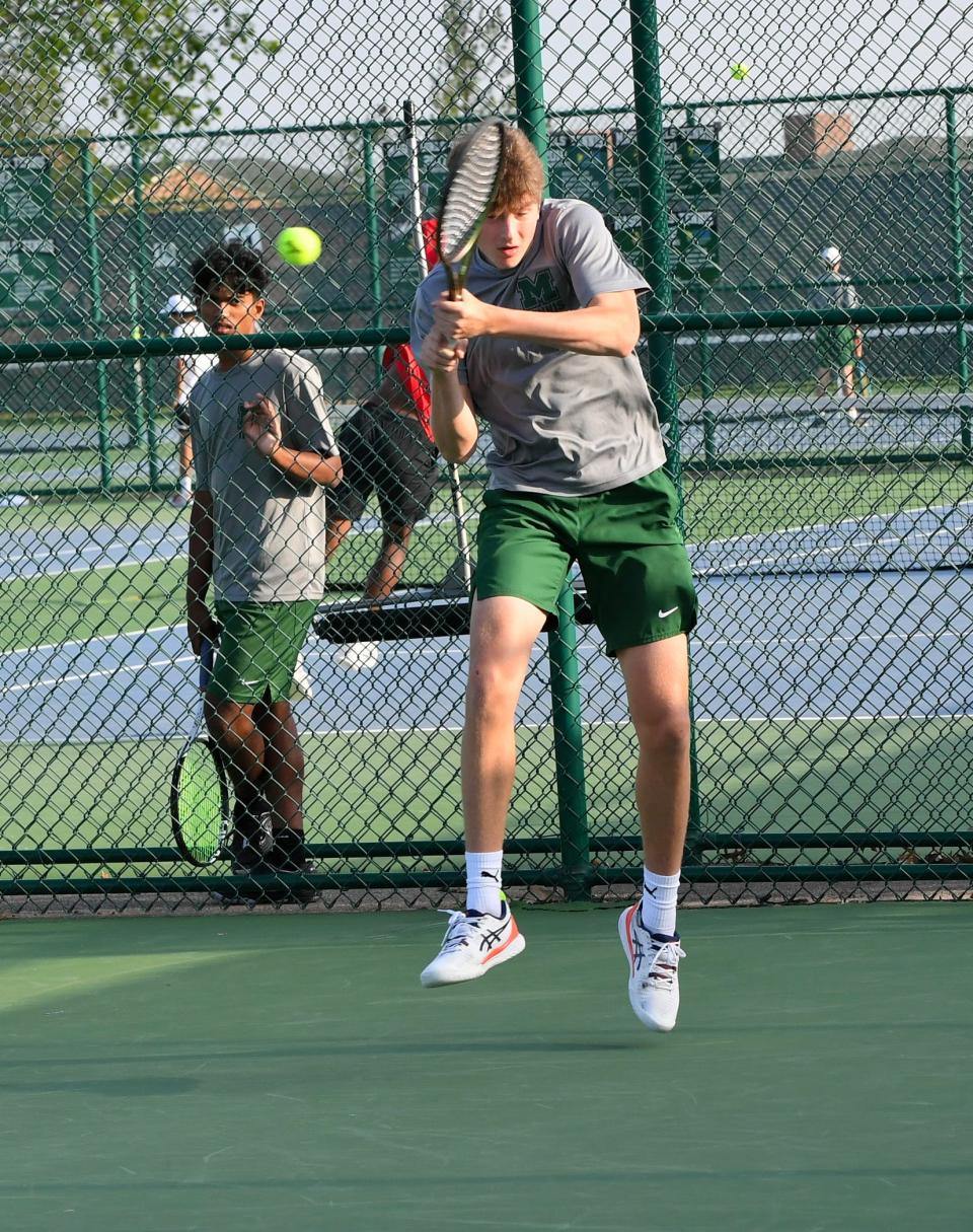 Mason's Daniel Tonkal makes a front hand return in the second singles at Flight A of the GCTCA Coaches Classic Tennis Tournament, Mason High School, April 27.