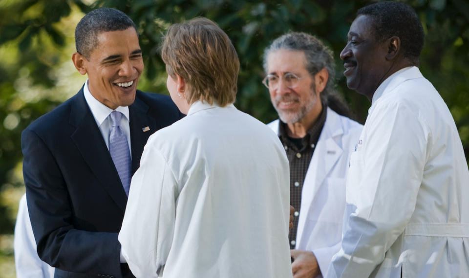 President Barack Obama greets doctors on stage after delivering remarks on the need for health insurance reform this year, in the Rose Garden of the White House in Washington in October 2009. (Photo: Brooks Kraft LLC/Corbis via Getty Images)