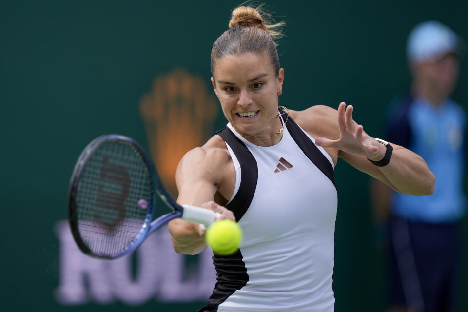 Maria Sakkari, of Greece, returns to Iga Swiatek, of Poland, during the final match at the BNP Paribas Open tennis tournament, Sunday, March 17, 2024, in Indian Wells, Calif. (AP Photo/Ryan Sun)