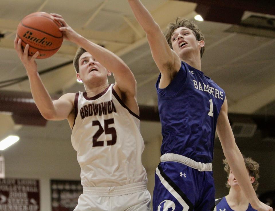 Brownwood's Luke Moss collects a rebounds against Lampasas' Kaeden Crawford.