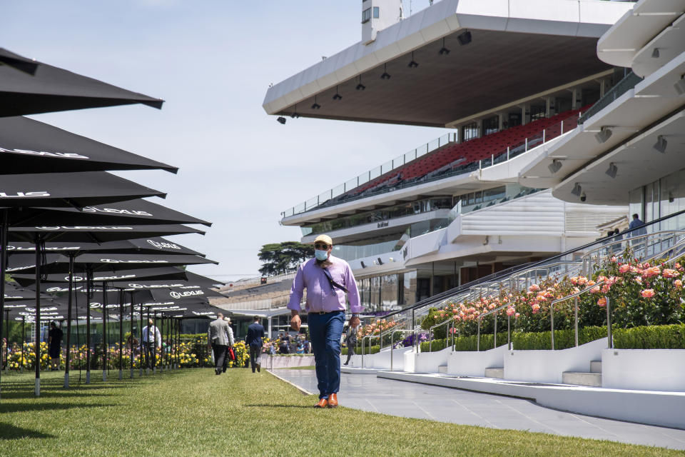 Empty venue and stands are seen prior to the Melbourne Cup horse race at Flemington Racecourse in Melbourne, Australia, Tuesday, Nov. 3, 2020. It was the first time in the race first held in 1861 that the race was held without spectators. (AP Photo/Andy Brownbill)
