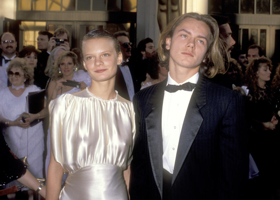 Actress Martha Plimpton and actor River Phoenix attend the 61st Annual Academy Awards on March 29, 1989 at Shrine Auditorium in Los Angeles, California. (Photo by Ron Galella, Ltd/Ron Galella Collection via Getty Images)