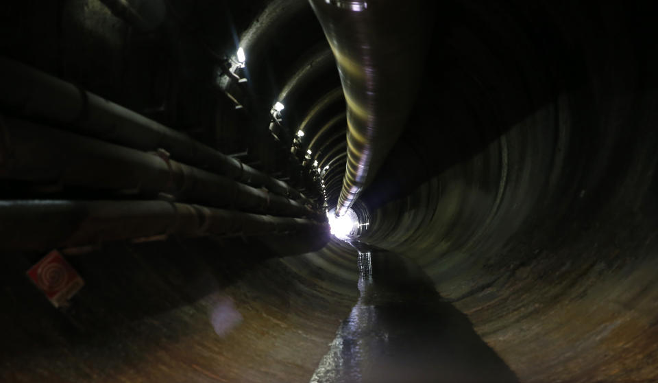 A view of a test and exploring tunnel for a Turin-Lyon high-speed rail (TAV) in Chiomonte, Italy, Tuesday, Feb. 12, 2019. The TAV project is part of a European wide network to improve high-speed rail connections. On the Italian side, the construction site long targeted by sabotaging protesters is guarded by four law enforcement agencies and has been reduced to maintenance work only. The survival of Italy's increasingly uneasy populist government could very well depend on whether Italy restarts construction on the TAV link, which it halted in June. (AP Photo/Antonio Calanni)