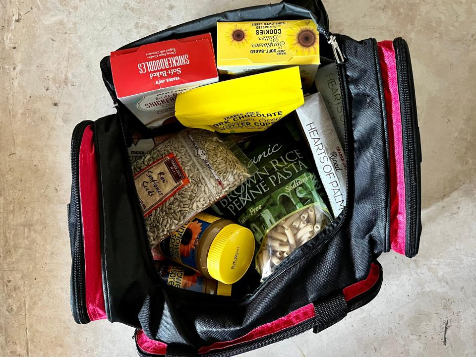 Suitcase filled with Trader Joe's items