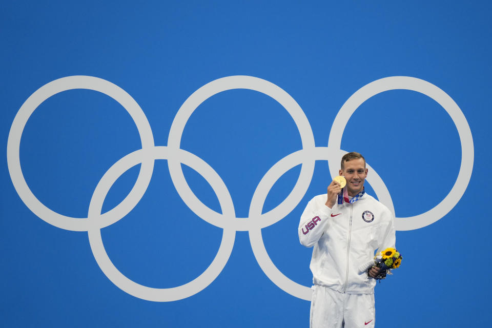 Caeleb Dressel, of United States, poses after winning the gold medal in the men's 50-meter freestyle final at the 2020 Summer Olympics, Sunday, Aug. 1, 2021, in Tokyo, Japan. (AP Photo/David Goldman)