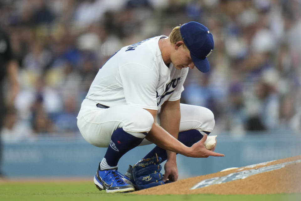 Los Angeles Dodgers starting pitcher Emmet Sheehan grabs a rosin bag while pitching against the Atlanta Braves during the third inning of a baseball game Saturday, Sept. 2, 2023, in Los Angeles. (AP Photo/Jae C. Hong)