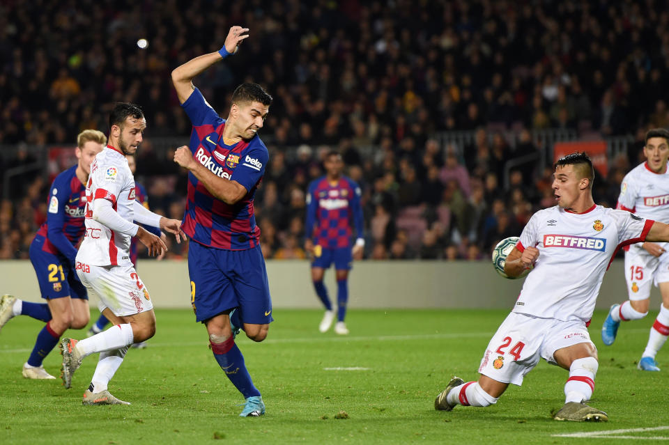 Luis Suarez's back-heel goal against Mallorca begs to be watched again and again. (Photo by Alex Caparros/Getty Images)