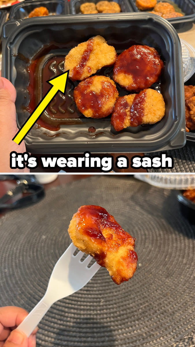 Chicken nuggets with barbecue sauce in a black plastic tray, one nugget has a sauce line resembling a sash. Text above reads, "it's wearing a sash."