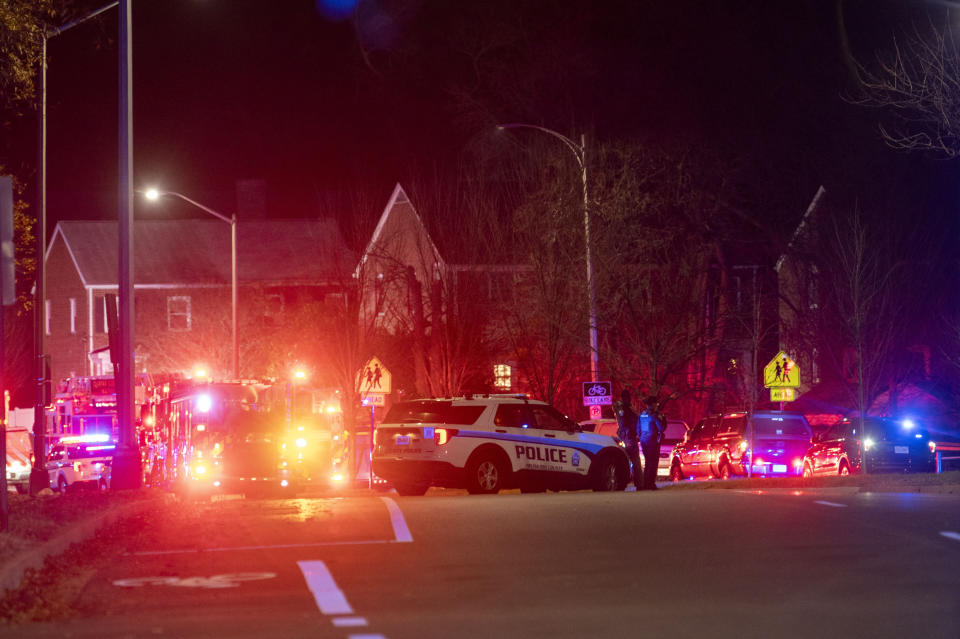 Arlington County Fire Department fire and police vehicles fill the street near the scene of a house explosion on Monday, Dec. 4, 2023, in Arlington, Va. (AP Photo/Kevin Wolf)