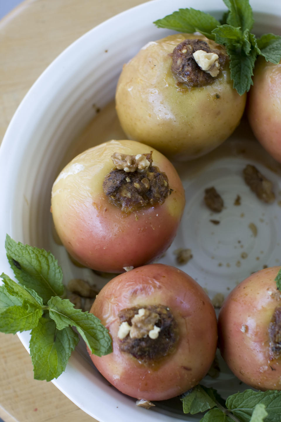 This July 29, 2013 photo shows baked honey date apples in Concord, N.H. (AP Photo/Matthew Mead)