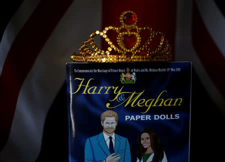 A Harry and Meghan paper doll souvenir book at the apartment of Ishea Brown in Seattle, Washington, U.S., May 14, 2018. Picture taken May 14, 2018. REUTERS/Lindsey Wasson
