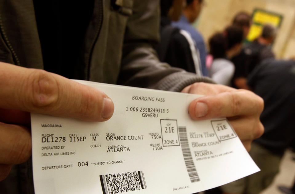 A passenger displays his boarding pass at John Wayne Orange County Airport in Santa Ana, California, on Sept. 11, 2011.