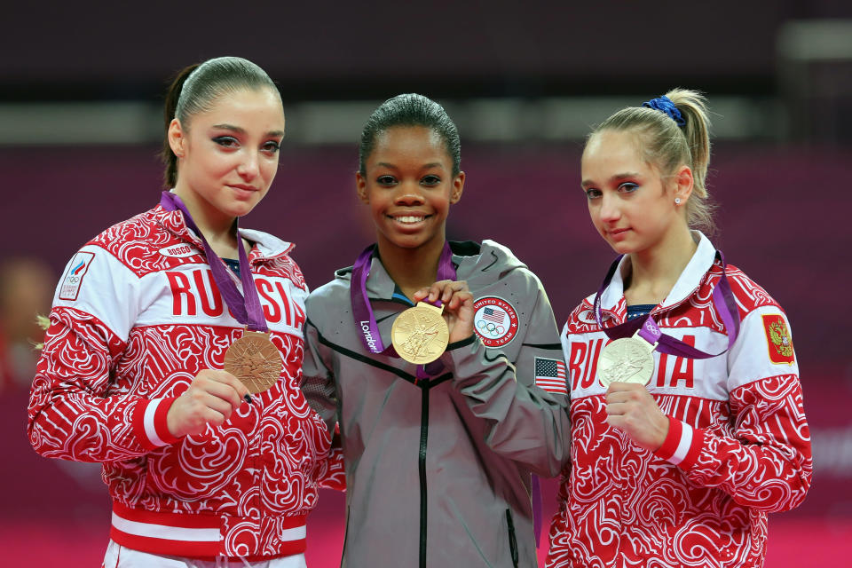 Bronze medalist Aliya Mustafina of Russia, gold medalist Gabrielle Douglas of the United States and silver medalist Victoria Komova of Russia pose after the medal ceremony in the Artistic Gymnastics Women's Individual All-Around final on Day 6 of the London 2012 Olympic Games at North Greenwich Arena on August 2, 2012 in London, England. (Photo by Julian Finney/Getty Images)