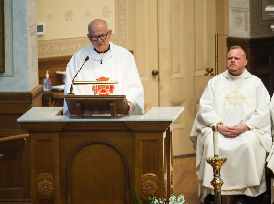 Rev. Walter Riley gives the homily during the funeral service for Worcester Fire Lt. Jason Menard at St. John Catholic Church Nov. 18, 2019.