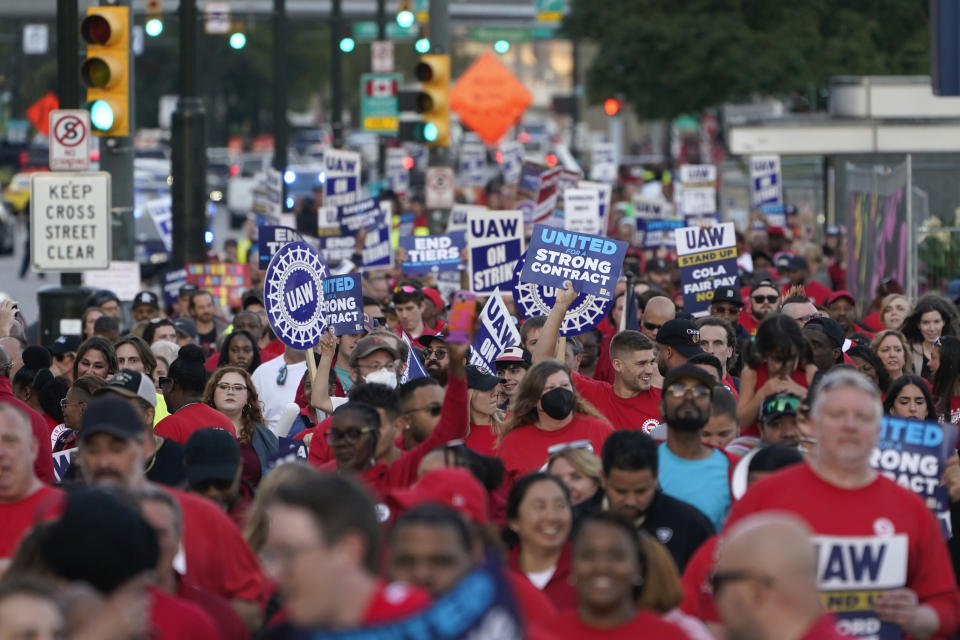 FILE - United Auto Workers members march through downtown Detroit, Friday, Sept. 15, 2023. The UAW is conducting a strike against Ford, Stellantis and General Motors. Former President Donald Trump will skip the second GOP presidential debate next week to travel to Detroit as the auto worker strike enters its second week. (AP Photo/Paul Sancya, File)