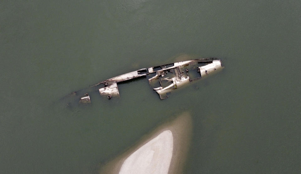 The wreckage of a WWII German warship is seen in the Danube river near Prahovo, Serbia, Monday, Aug. 29, 2022. The worst drought in Europe in decades has not only scorched farmland and hampered river traffic, it also has exposed a part of World War II history that had almost been forgotten. The hulks of dozens of German battleships have emerged from the mighty Danube River as its water levels dropped. (AP Photo/Darko Vojinovic)