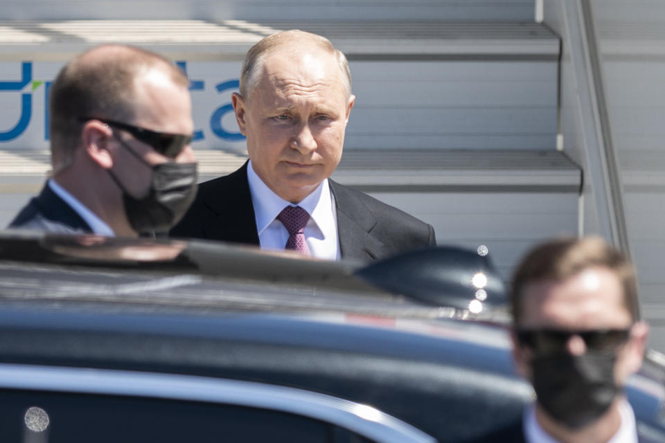 Russian president Vladimir Putin, center gets into his car after his arrival for the US - Russia summit with US President Joe Biden in Geneva, Switzerland, Wednesday, June 16, 2021. (Alessandro della Valle/Keystone via AP, Pool)