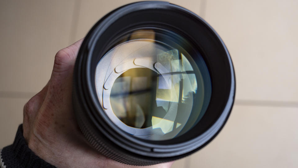 Close up of the Nikon Z 135mm f/1.8 S Plena lens aperture blades half stopped down