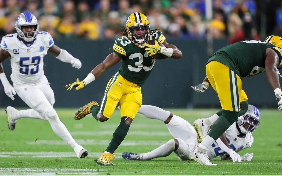 Green Bay Packers running back Aaron Jones (33) runs the ball against the Detroit Lions during their football game on Thursday, September 28, 2023, at Lambeau Field in Green Bay, Wis. The Lions won the game, 34-20. Tork Mason/USA TODAY NETWORK-Wisconsin