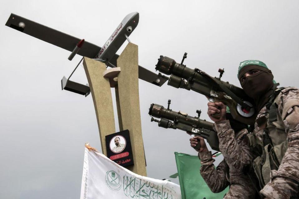 Members of the Ezz ad-Din al-Qassam Brigades, the military wing of the Palestinian Islamist movement Hamas, attend a memorial in the southern Gaza Strip town of Rafah on January 31, 2017 (AFP)