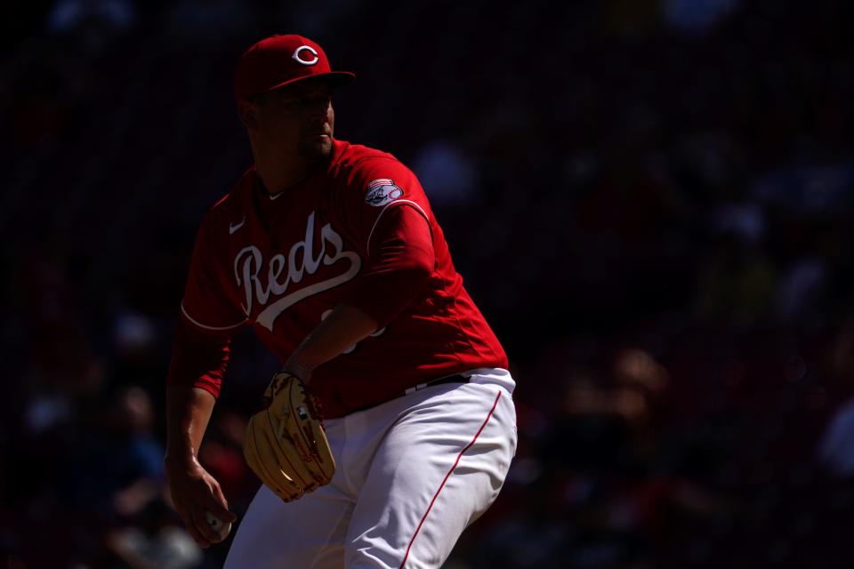 Cincinnati Reds relief pitcher Joel Kuhnel (66) delivers a pitch during the eighth inning of a baseball game, Sunday, July 10, 2022, at Great American Ball Park in Cincinnati. The Cincinnati Reds won, 10-5.