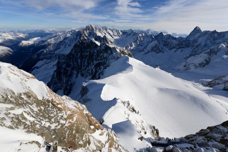 File picture taken on December 23, 2013 shows the Aiguille Du Midi peak in the Mont Blanc range, in Chamonix in the French Alps. Helicopter rescue teams have discovered the bodies of the three victims near the Aiguille du Midi peak
