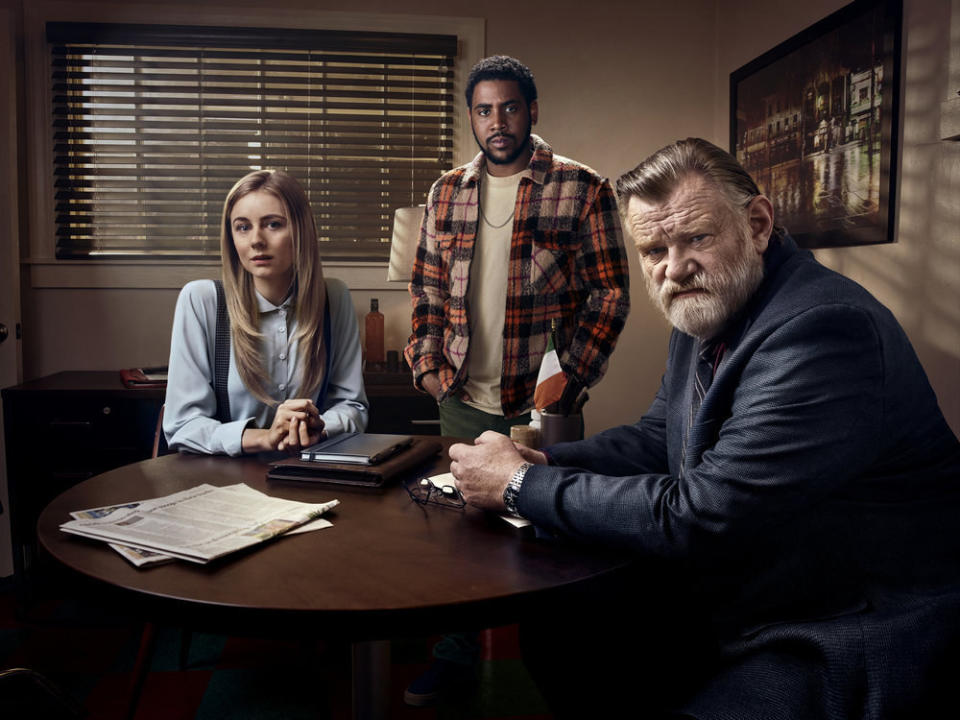 Justine Lupe, Jharrel Jerome,  Brendan Gleeson sitting around a table