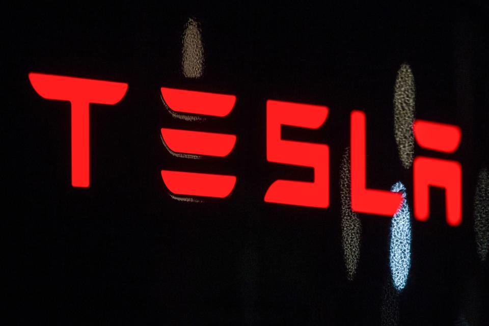 Tesla logo in red