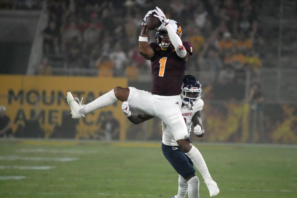 Arizona State wide receiver Xavier Guillory (1) makes a catch in front of Fresno State defensive back Al'zillion Hamilton during the first half of an NCAA college football game Saturday, Sept. 16, 2023, in Tempe, Ariz. (AP Photo/Rick Scuteri)