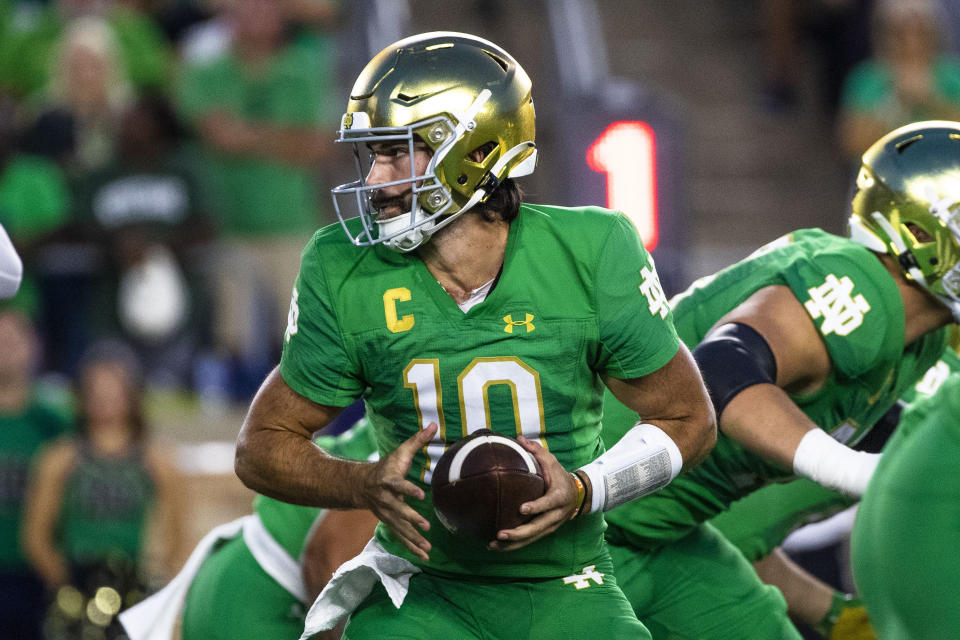 Notre Dame quarterback Sam Hartman looks to hand the ball off during the first half of the team's NCAA college football game against Ohio State on Saturday, Sept. 23, 2023, in South Bend, Ind. (AP Photo/Michael Caterina)