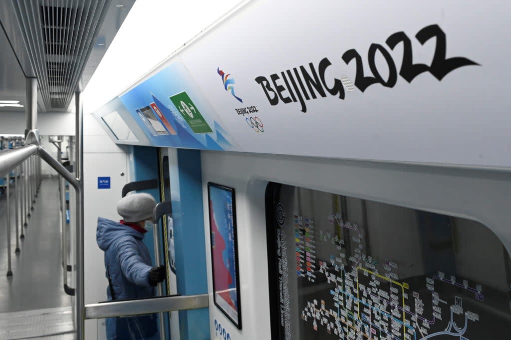 Signage for the 2022 Winter Olympic Games displayed on a subway train in Beijing (AFP via Getty Images)