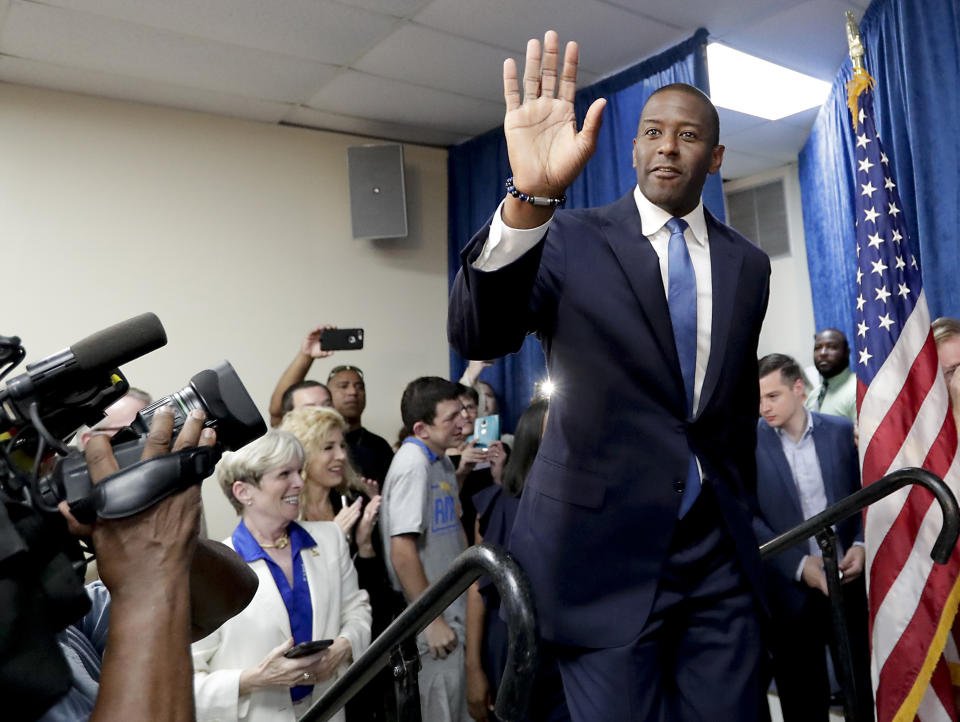 Florida Democratic gubernatorial candidate Andrew Gillum greets supporters as he arrives at a Democratic Party rally Friday, Aug. 31, 2018, in Orlando, Fla. (AP Photo/John Raoux)