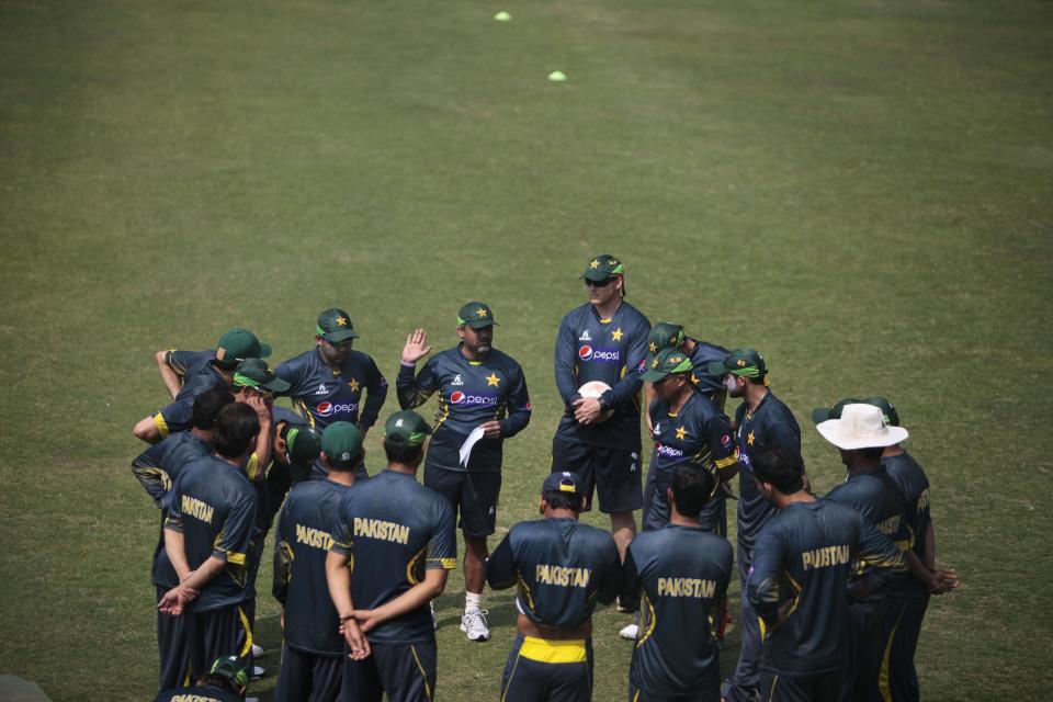 Pakistan cricket players huddle together during a practice session ahead of the Asia Cup tournament in Dhaka, Bangladesh, Monday, Feb. 24, 2014. Pakistan plays Sri Lanka in the opening match of the five nation one day cricket event that begins Tuesday. (AP Photo/A.M. Ahad)