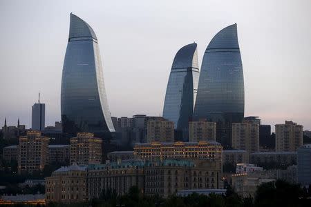 The Flame Towers, one of Baku's famous skyscrapers, is pictured at sunset, Azerbaijan June 18, 2015. REUTERS/Stoyan Nenov