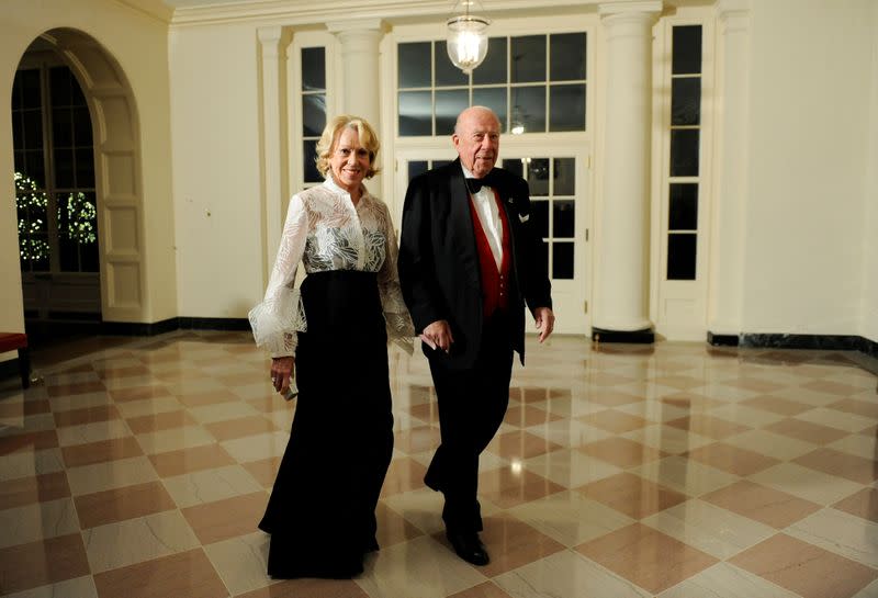 FILE PHOTO: Shultz arrives with his wife arrive for a state dinner in Washington