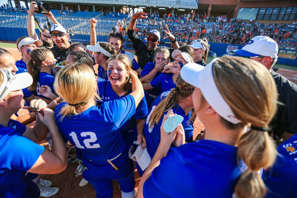 Piedmont players celebrate defeating Coweta 5-3, to win the Class 5A fastpitch softball championship last year. They will be looking to three-peat this year.