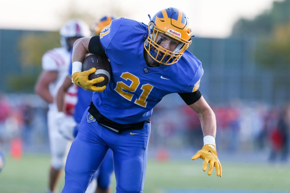 Greenfield Central's Jacob Hinton (21) on the run during Greenfield-Central vs New Palestine High School IHSAA football, Sep 22, 2023; Greenfield, IN, USA; at Greenfield-Central High School.