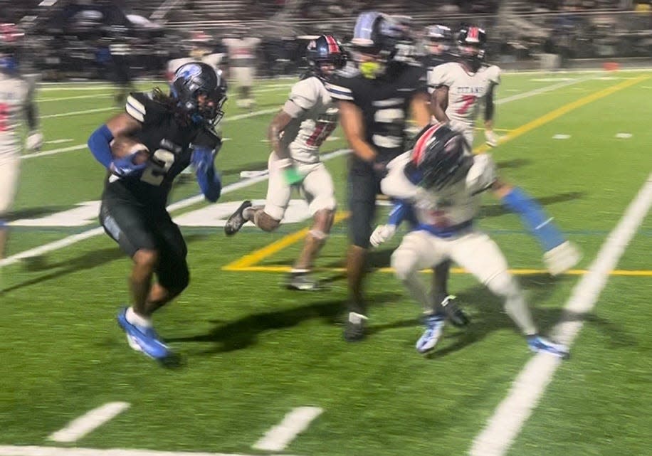 Armwood's Girard Pringle Jr. carries the ball down the sideline against Tampa Bay Tech, Sept. 6, 2024.