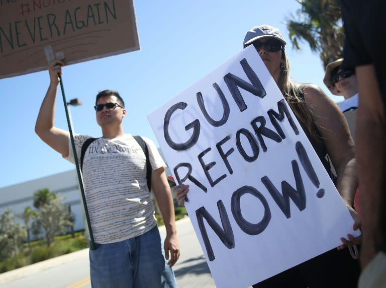 Activists protest outside Kalashnikov USA, a manufacturer of AK-47 rifles, on February 25, 2018 in Pompano Beach, Florida, near Parkland where the shooting deaths of 17 students and staff at a school has boosted calls for gun control