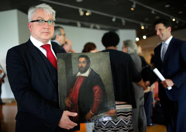 Markus H. Stoetzel, Attorney representing heir of Dr. August Liebmann Mayer holds the painting "Portrait of a Man" lost as a result of Nazi persecution and returned to its rightful heir after a press conference on May 5, 2015 in New York