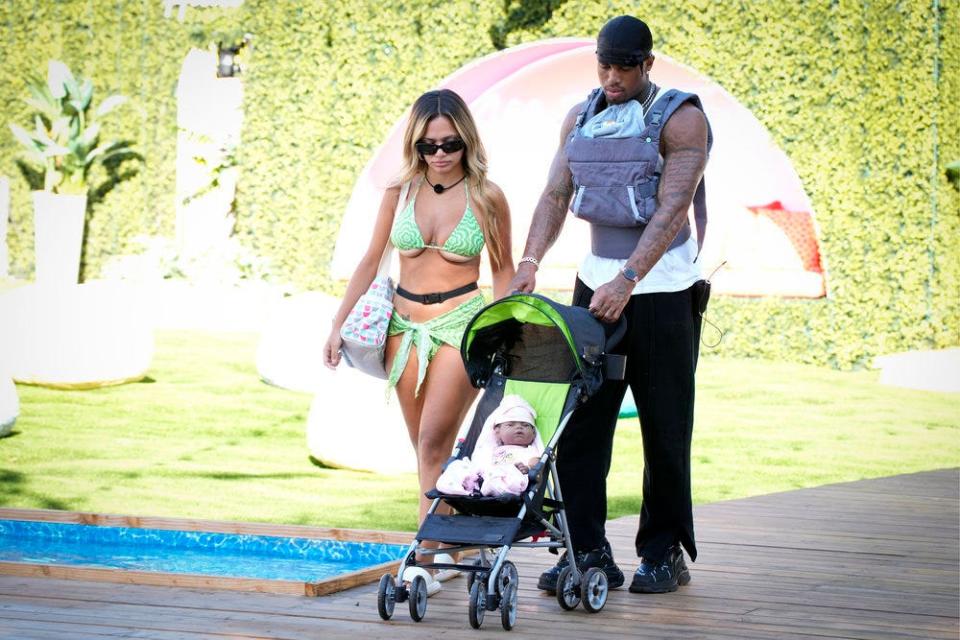 Nadjha Day (left) and Jeff Christian Jr. take care of their robotic baby on Season 4, Episode 34, of "Love Island."